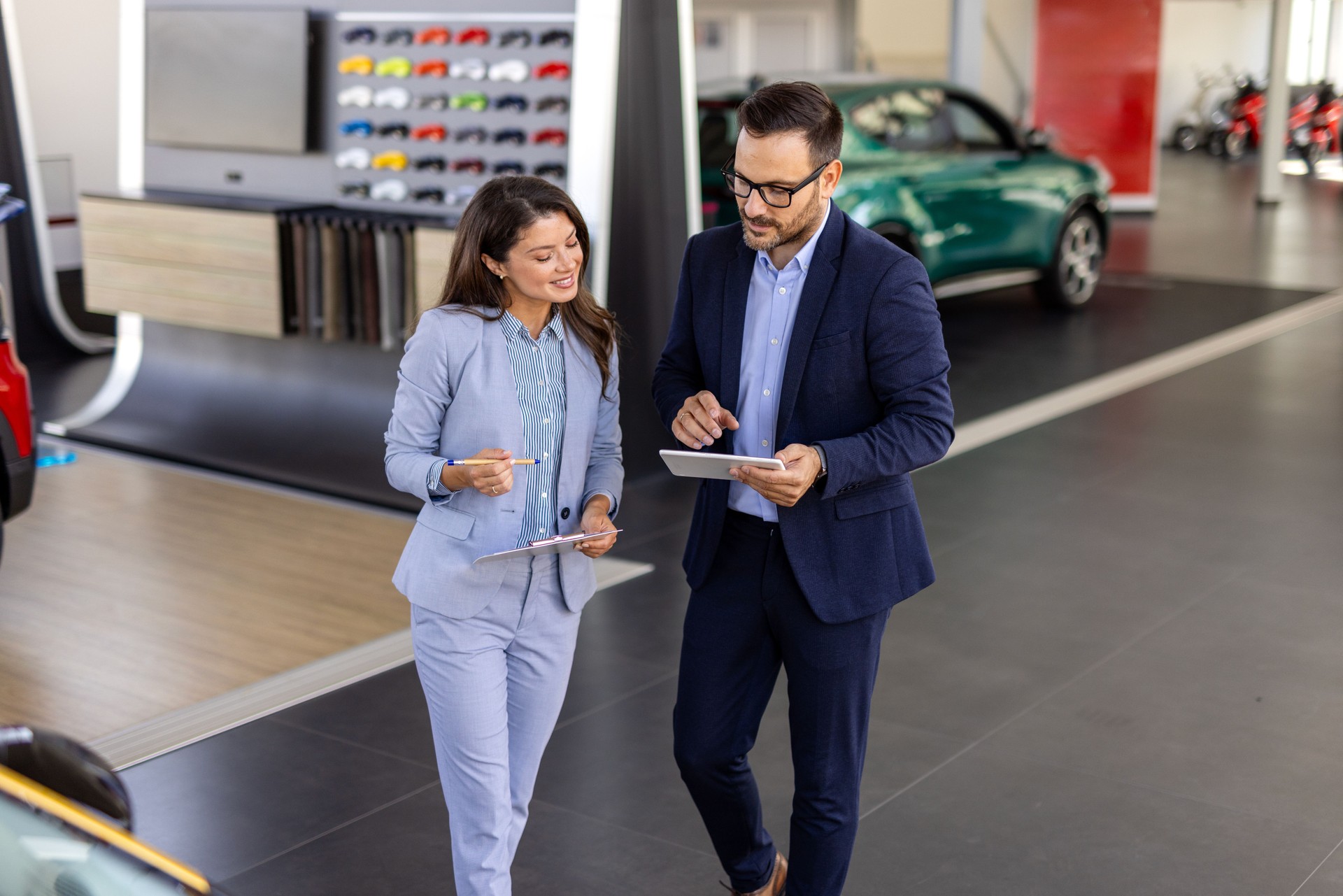 Car dealership, salesman or happy woman shaking hands for vehicle, finance agreement or purchase. Payment, smile or seller in showroom for good service, transportation business or automobile loan